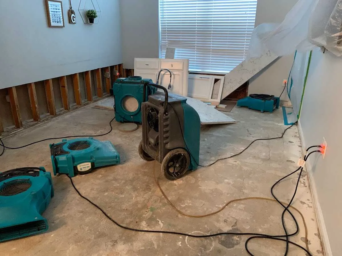 Dehumidifier in flood-cut room for Water Damage Restoration in Bend